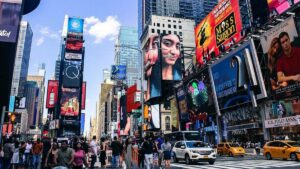 ground street view of cars and signs along Times Square in Manhattan NYC, New York, USA